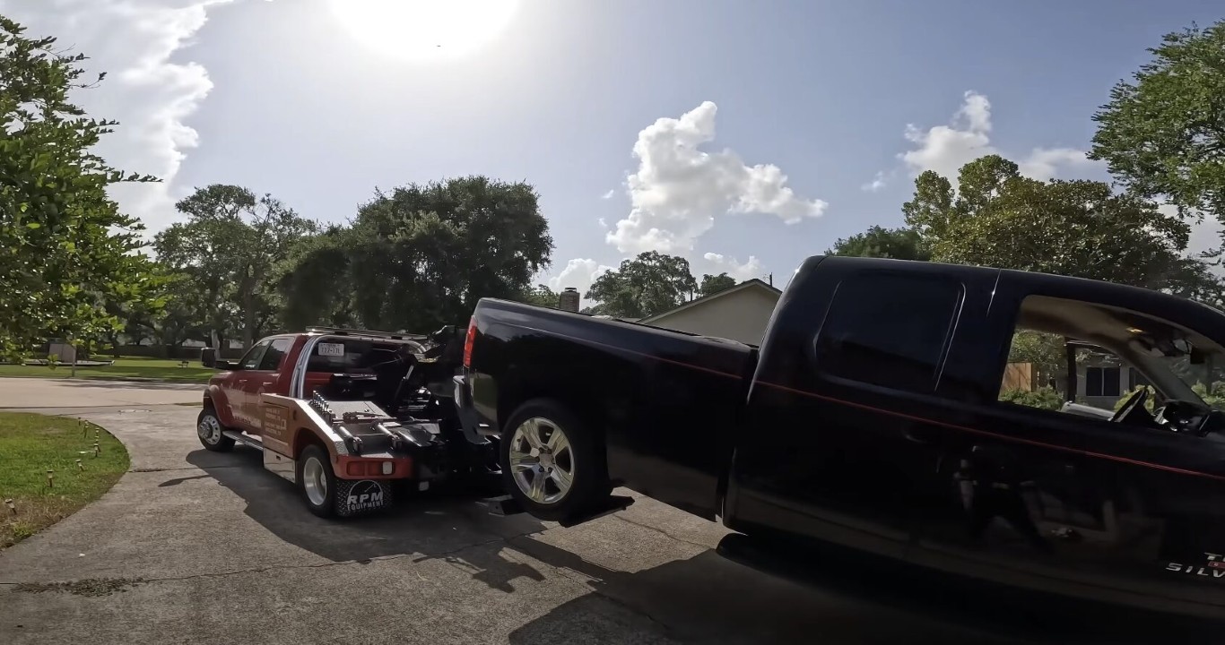 Pickup truck being towed on flatbed for maximum vehicle protection in Mount Prospect